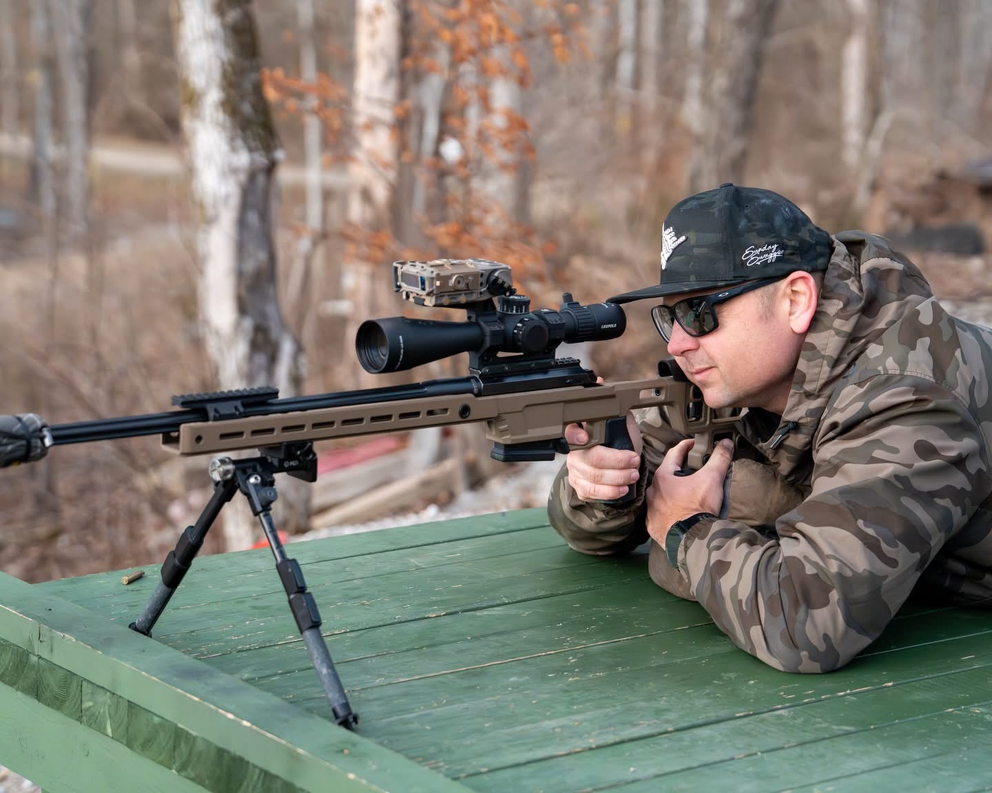 Instructor working with a student during a private shooting session in the field